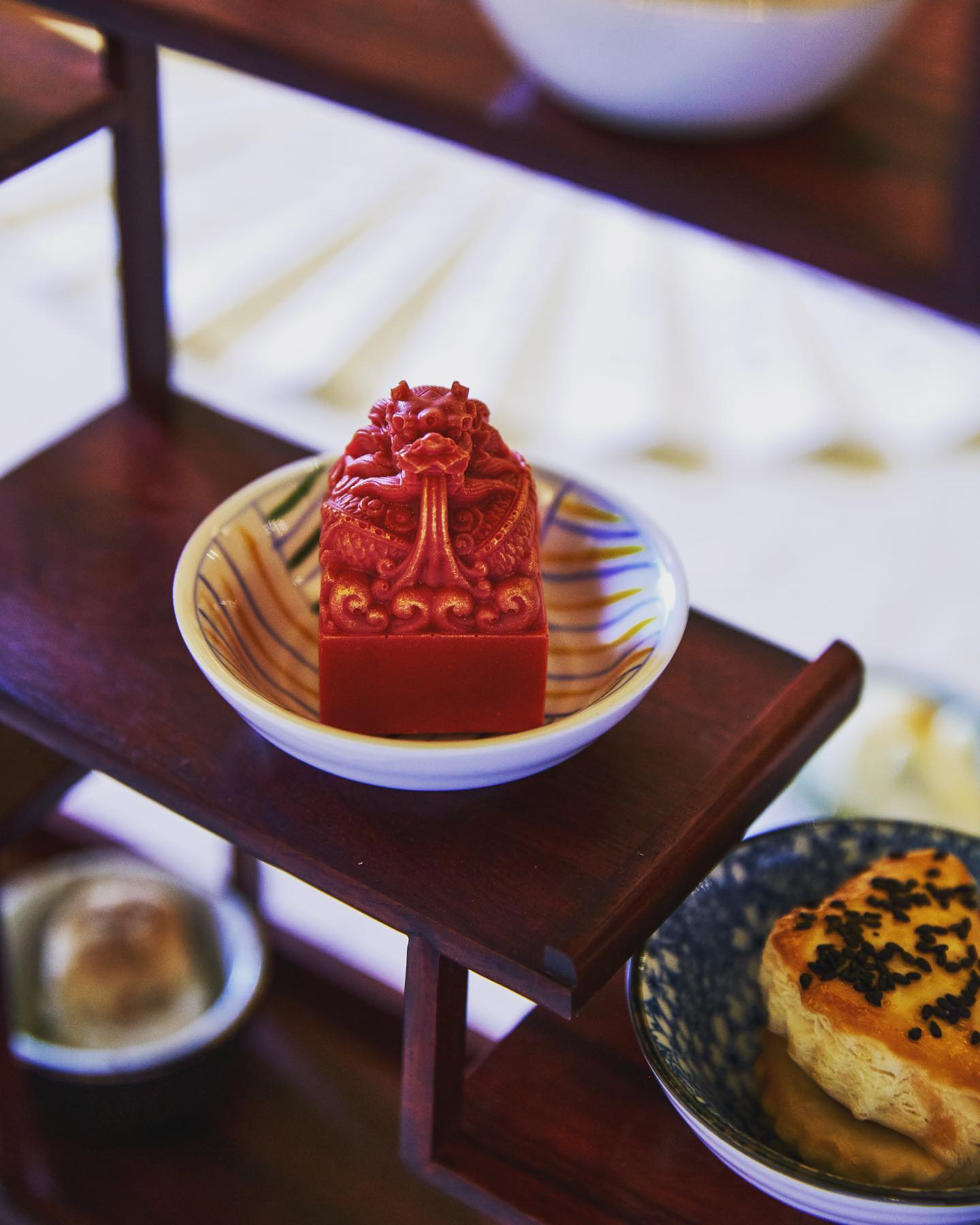 a red square object on a small bowl