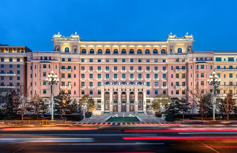 a large building with lights on the front