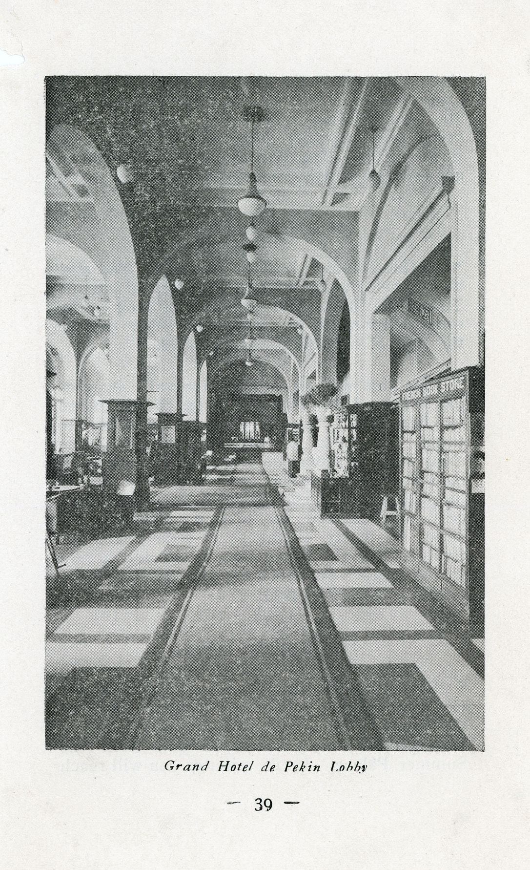 a black and white photo of a hallway