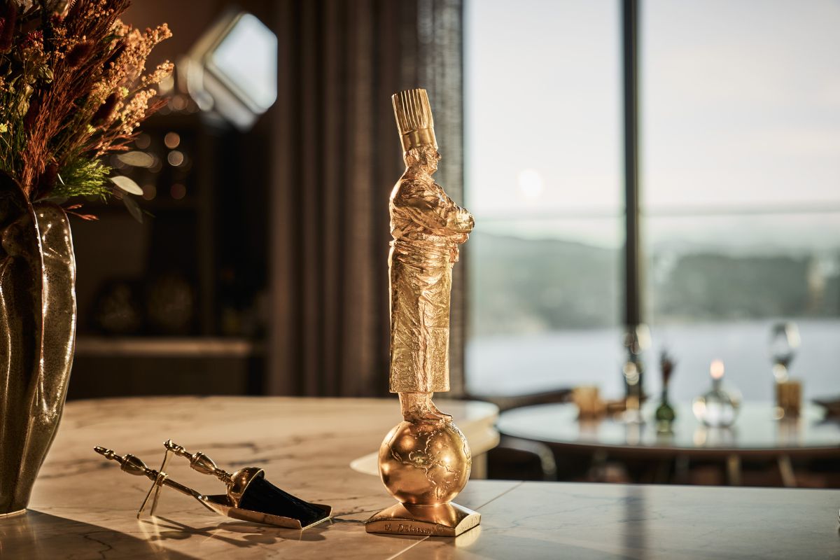 a gold statue on a table