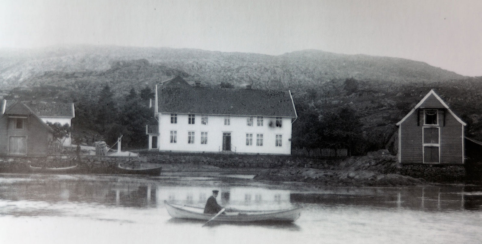 a man in a boat on a lake