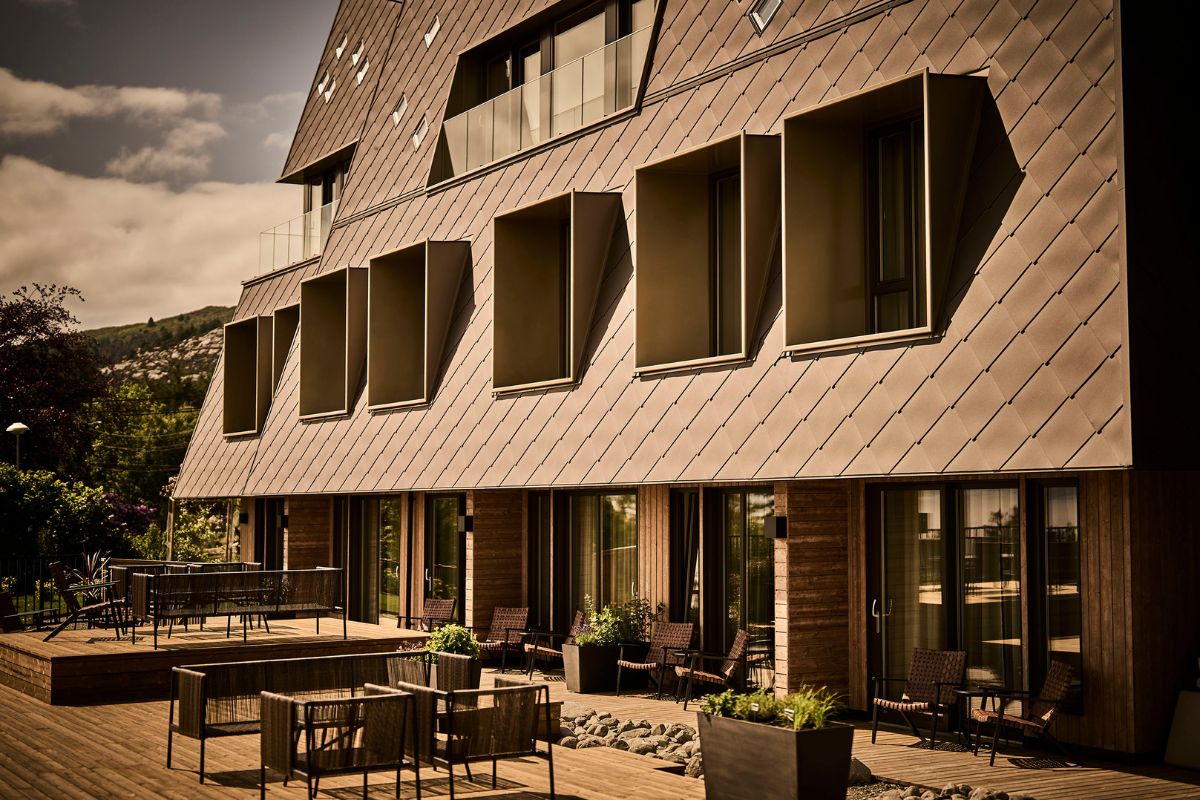 a building with a patio and chairs