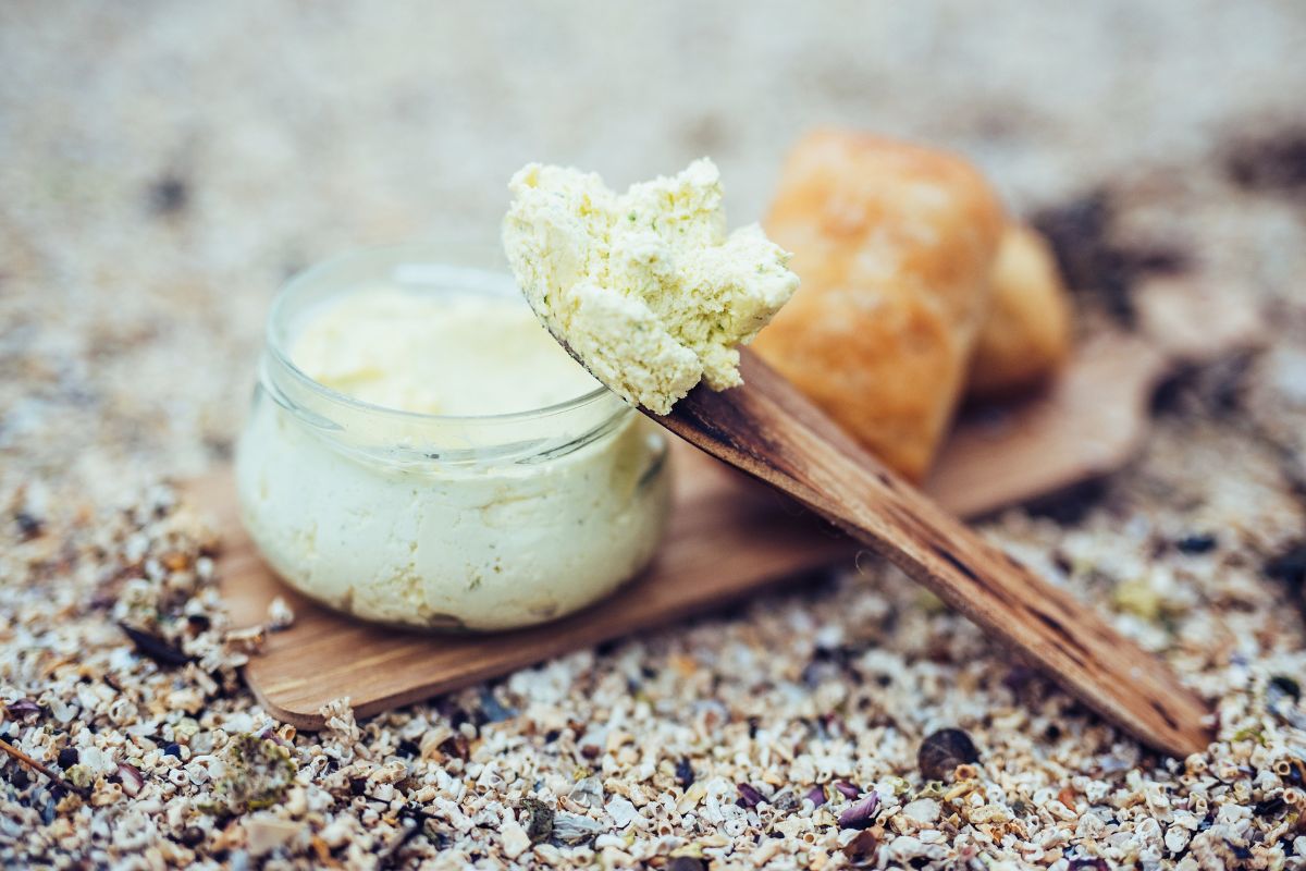 a spoonful of butter on a wooden board
