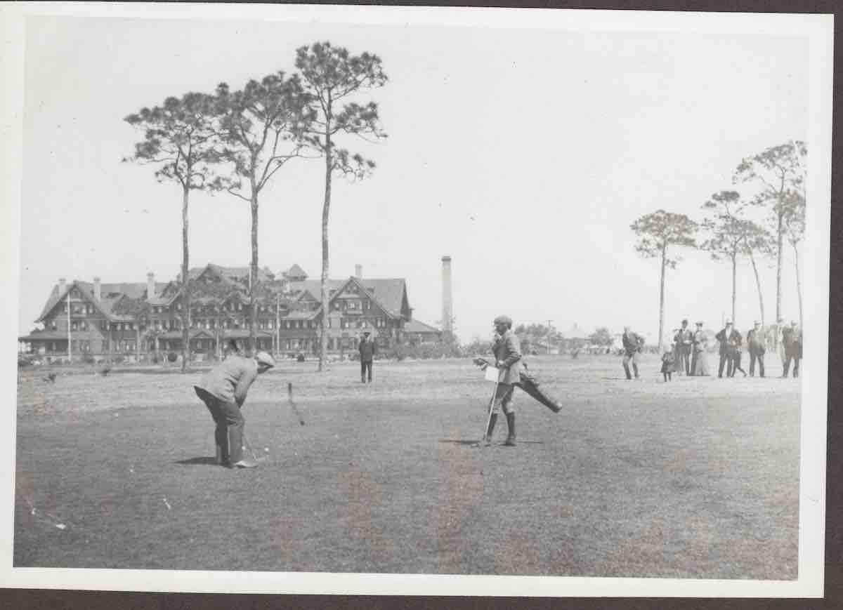 a group of people playing golf
