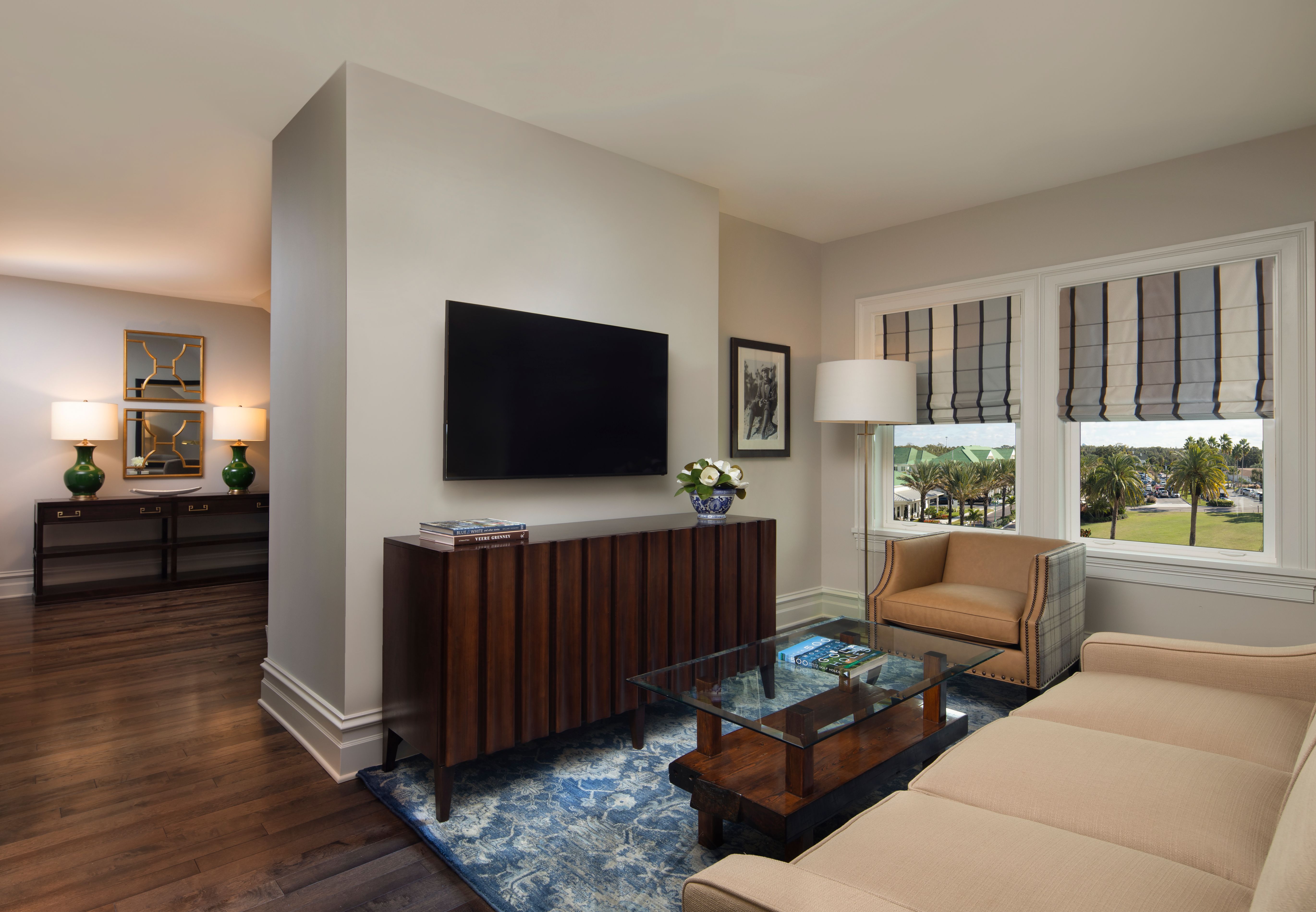 a living room with a tv on the wall