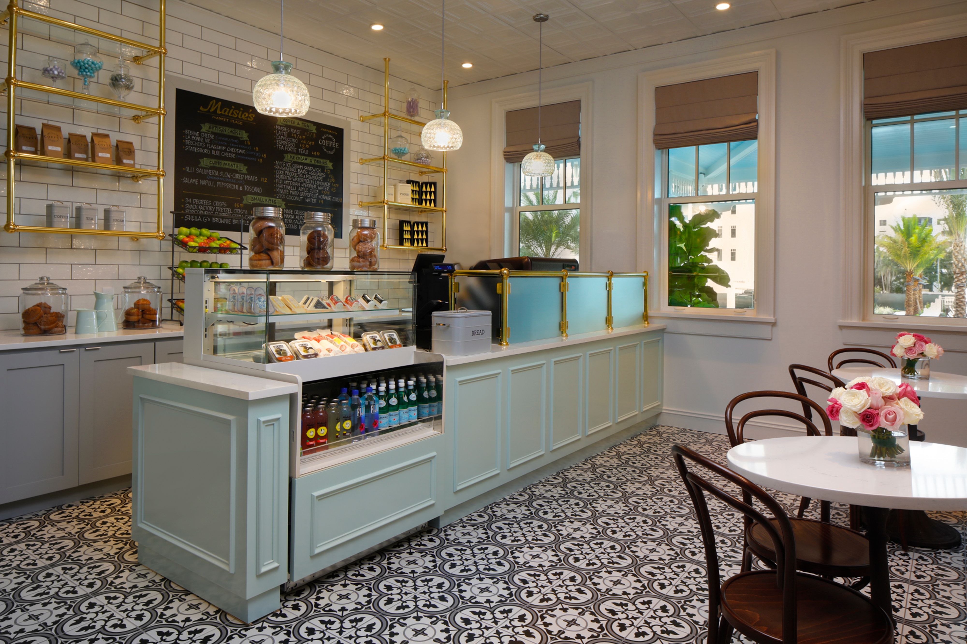 a coffee shop with a counter and chairs