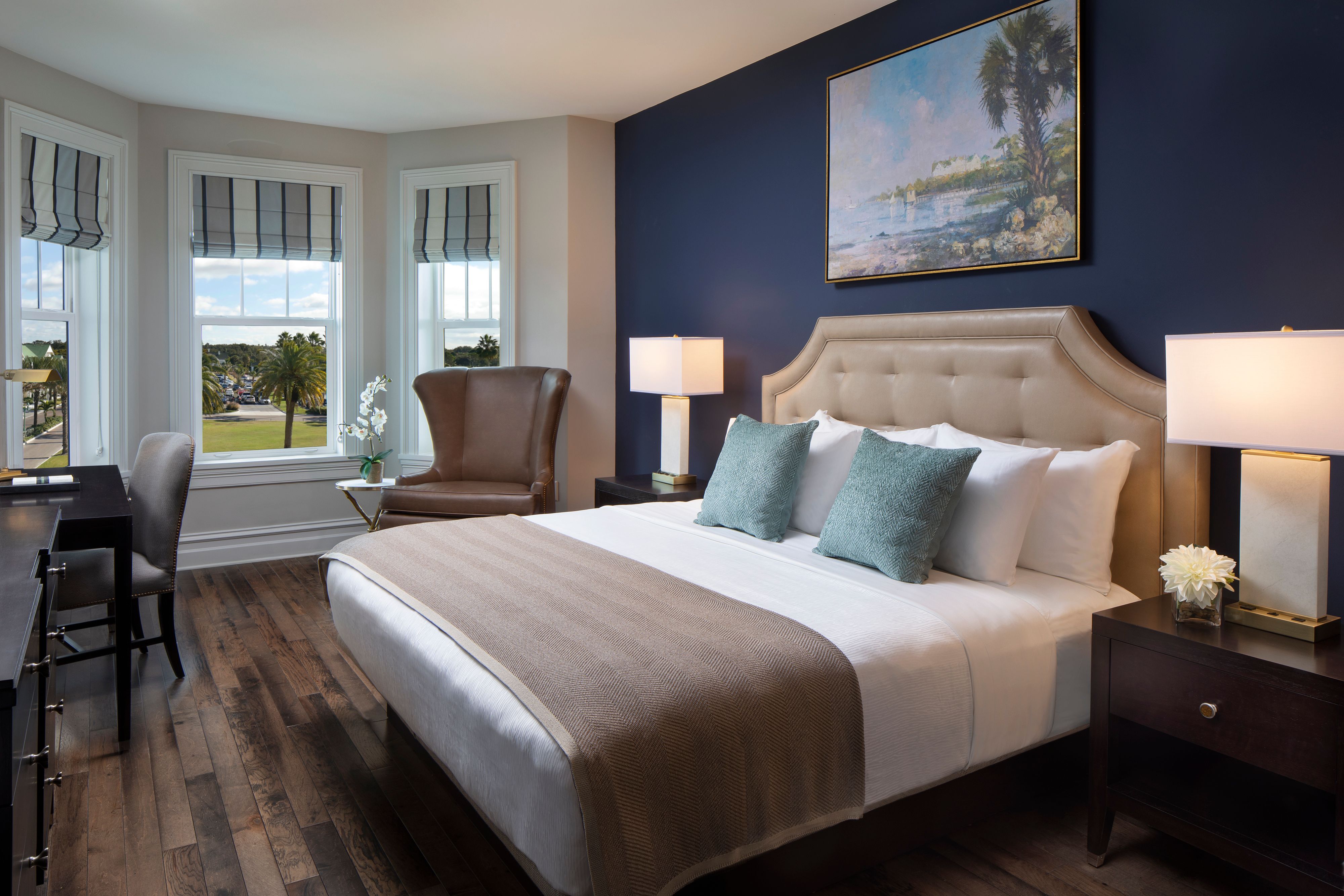 a bedroom with a bed and a chair