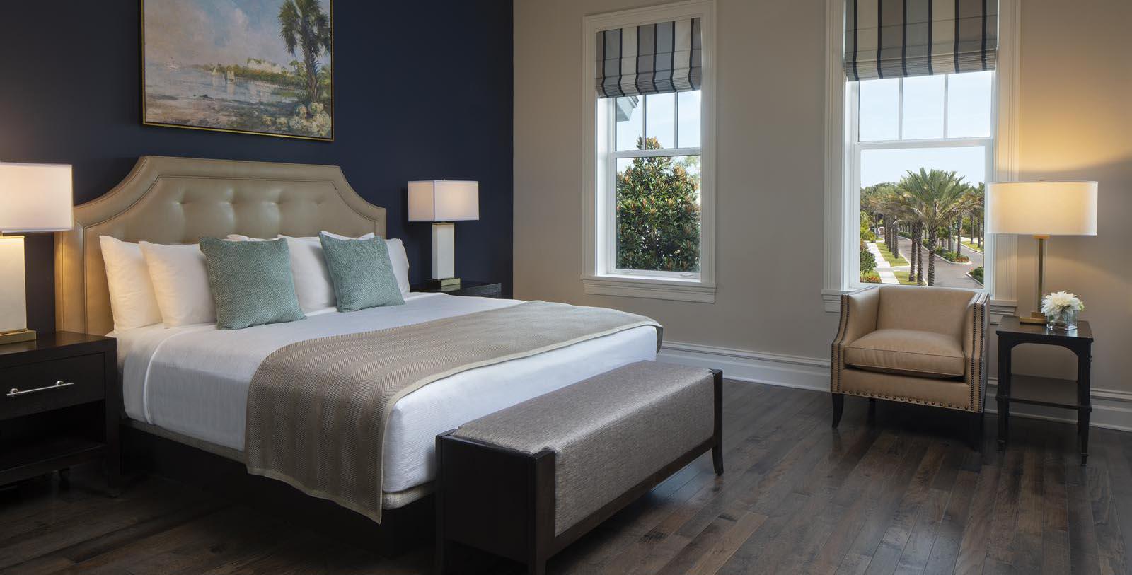 a bedroom with a bed and a bench