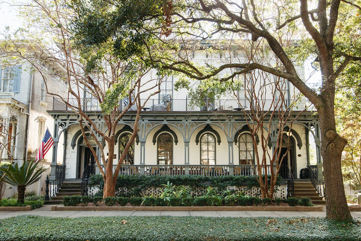 a building with trees and bushes