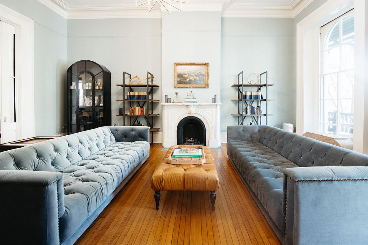 a living room with a fireplace and couches