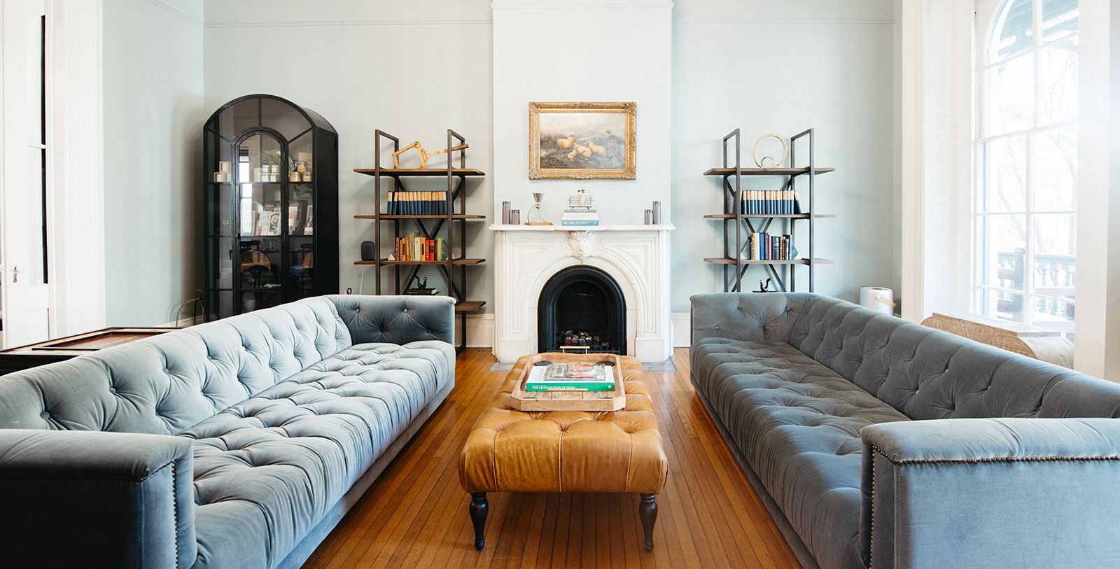 a living room with a fireplace and couches
