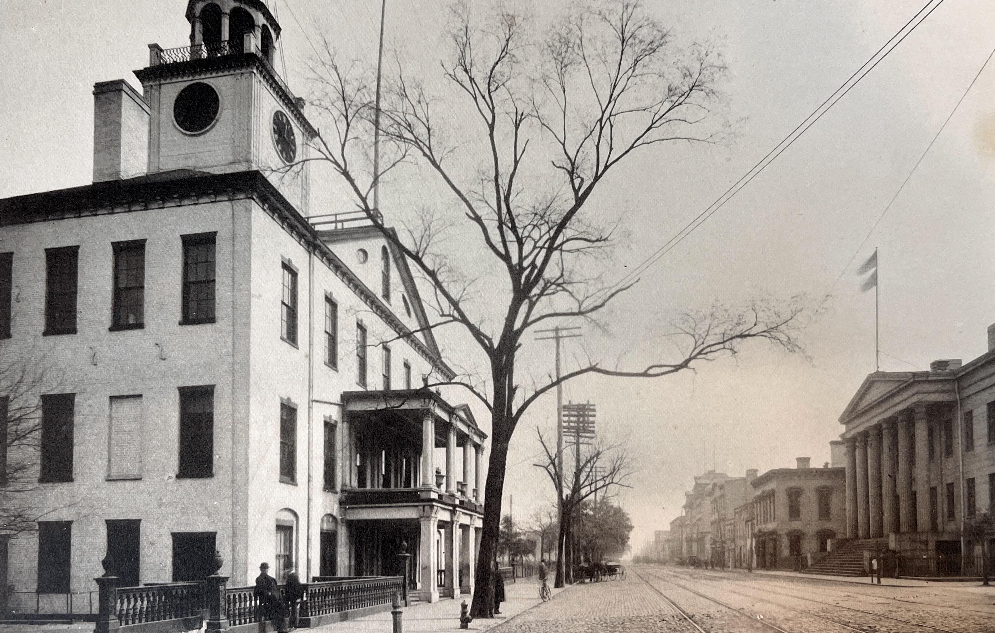 a white building with a clock tower