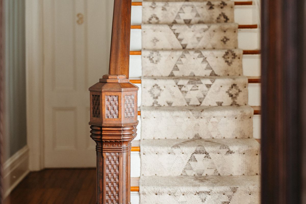 a staircase with a carpeted stair case