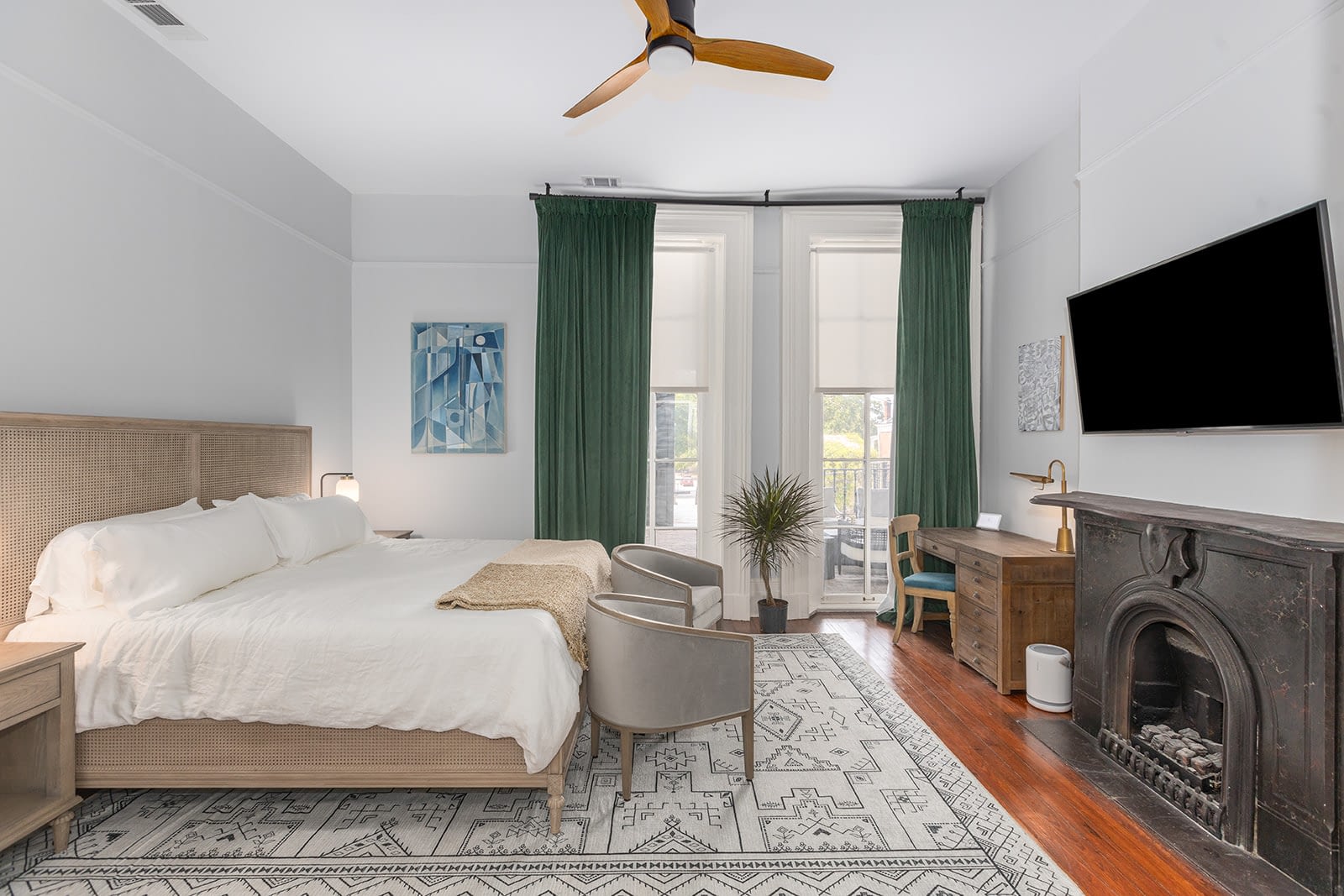 a bedroom with a fireplace and a bed