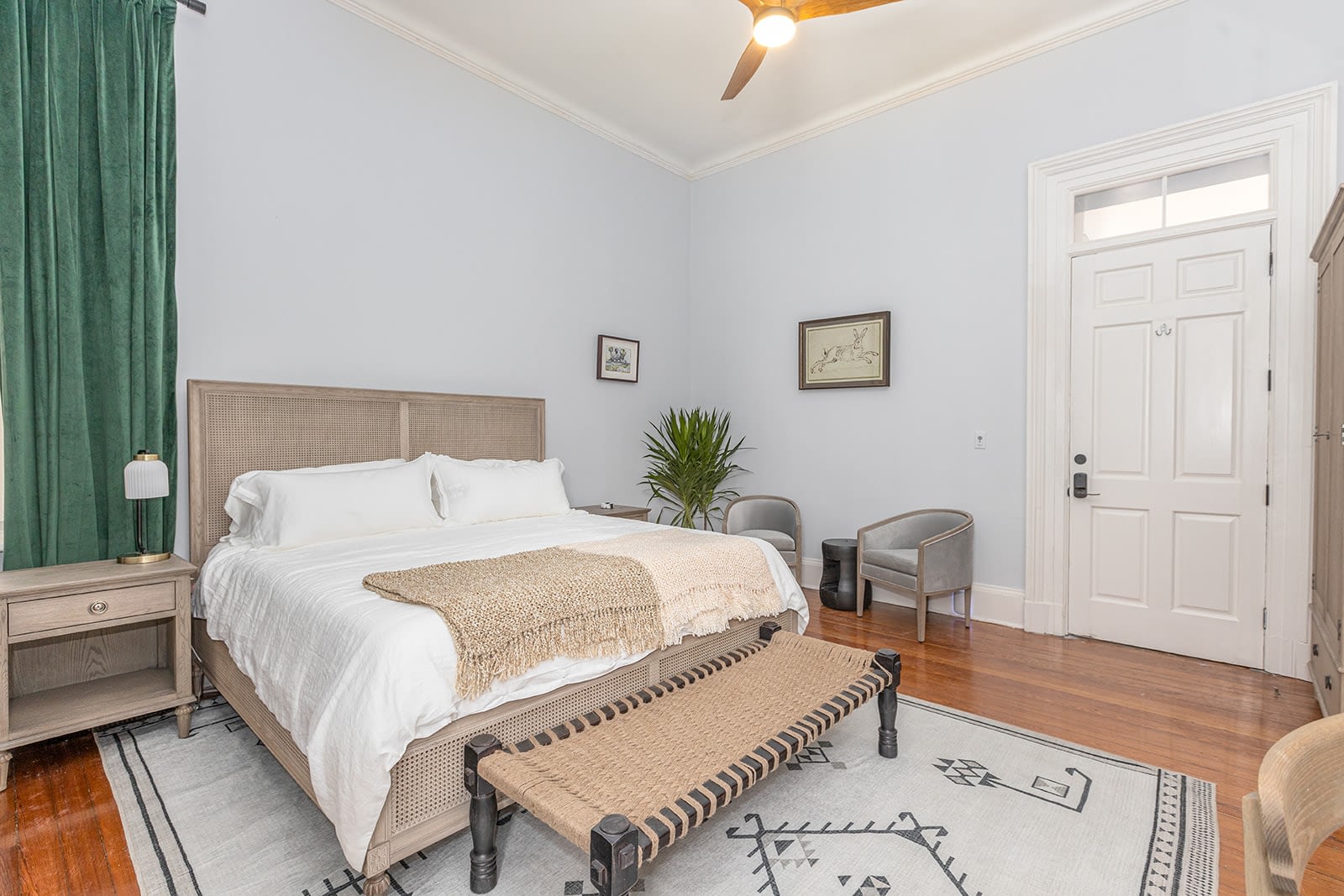 a bedroom with a bed and a bench