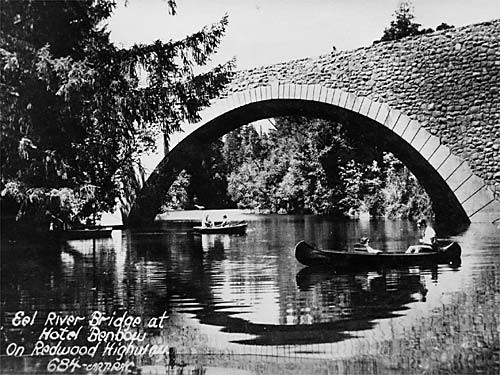 a stone bridge over a river