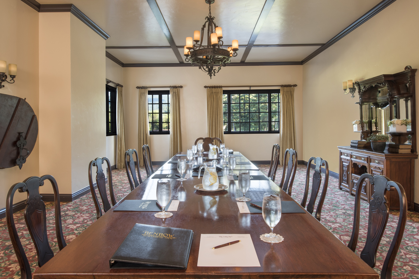 a room with a long table and chairs
