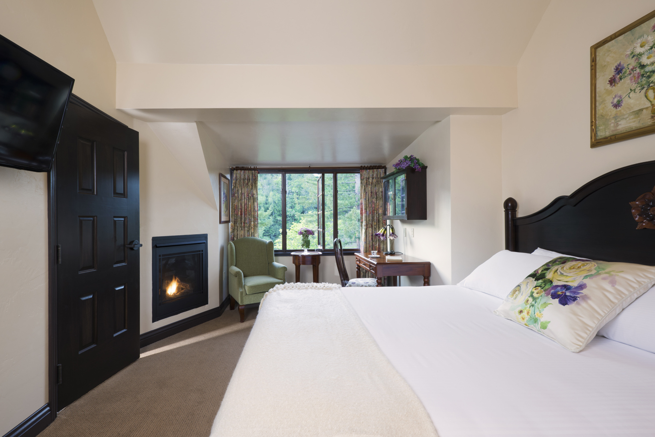 a room with a fireplace and a bed