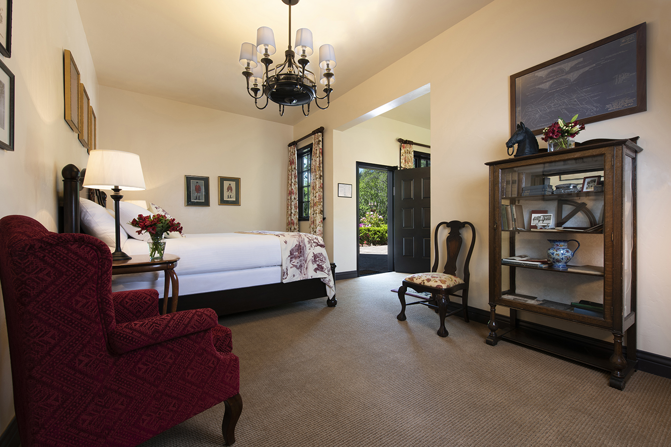 a bedroom with a bed and a chair