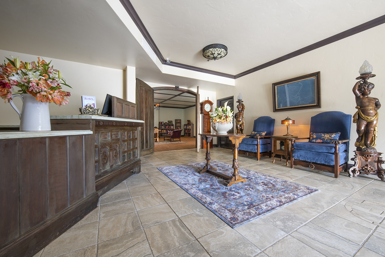a lobby with a table and chairs