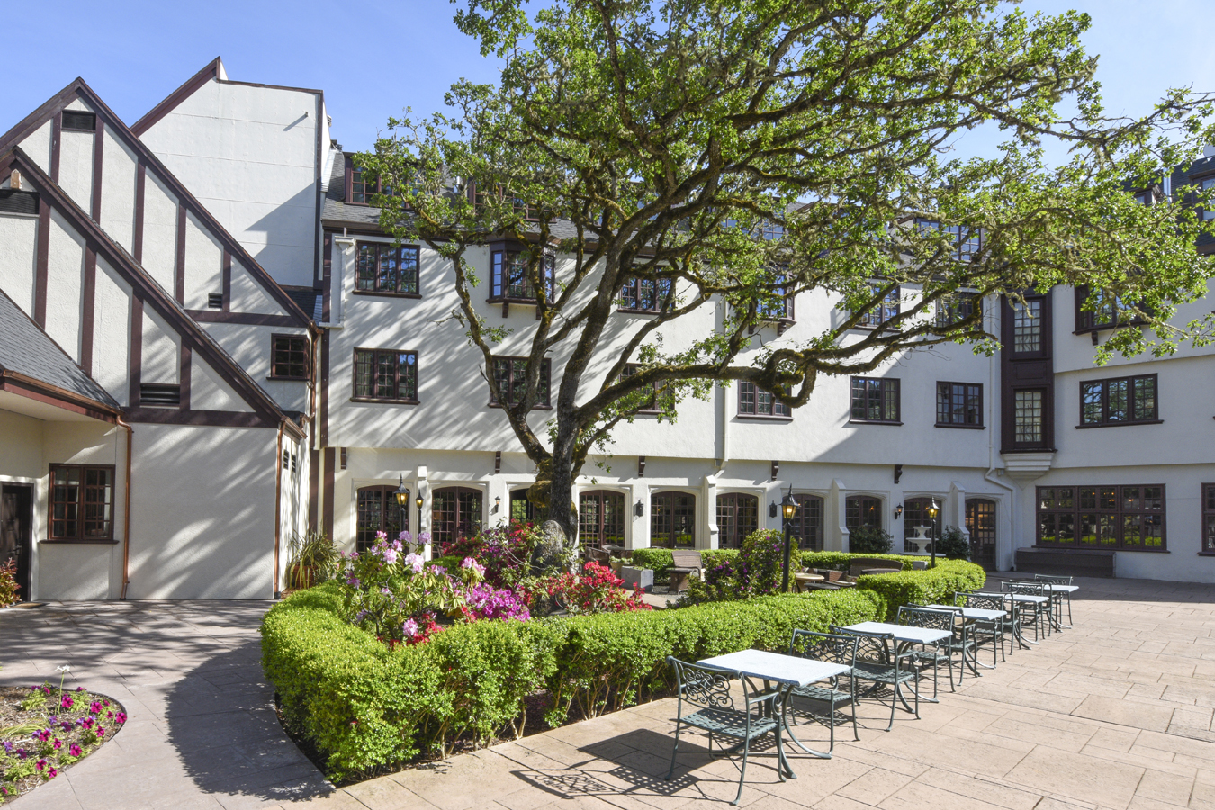 a building with tables and chairs in front of it