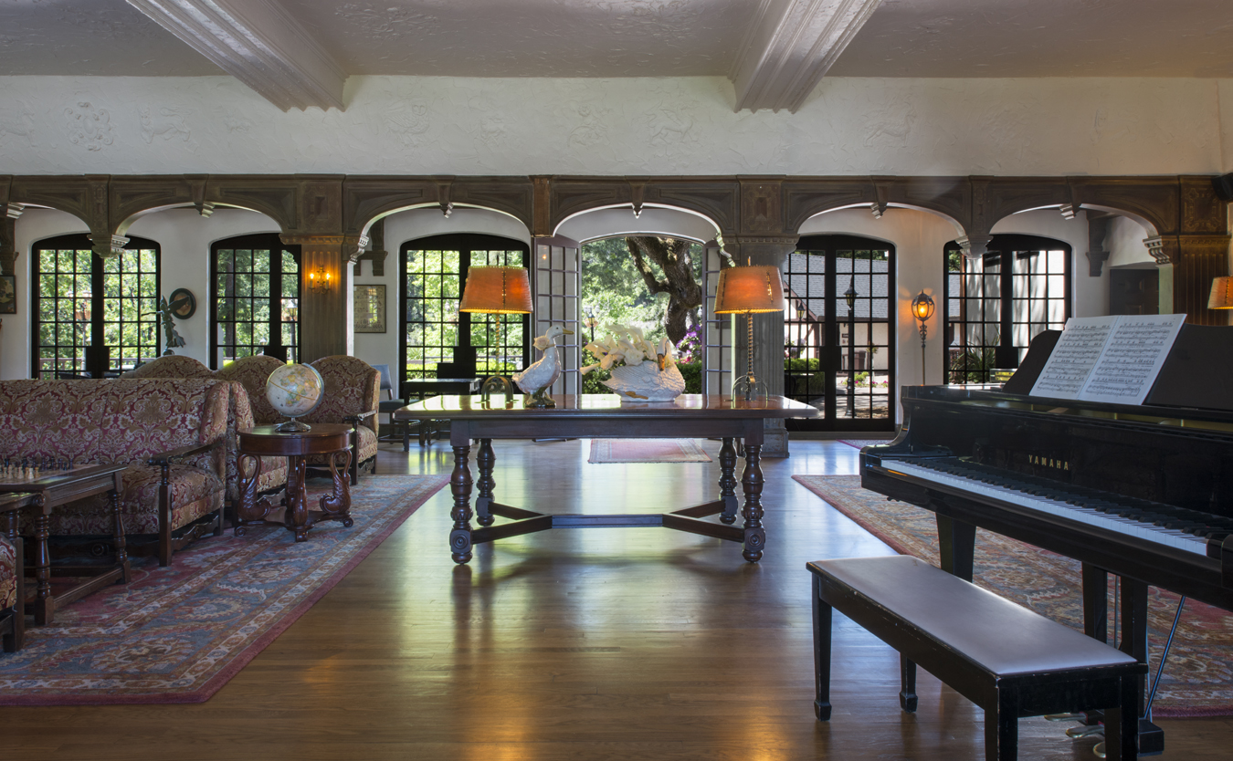 a room with a piano and a table