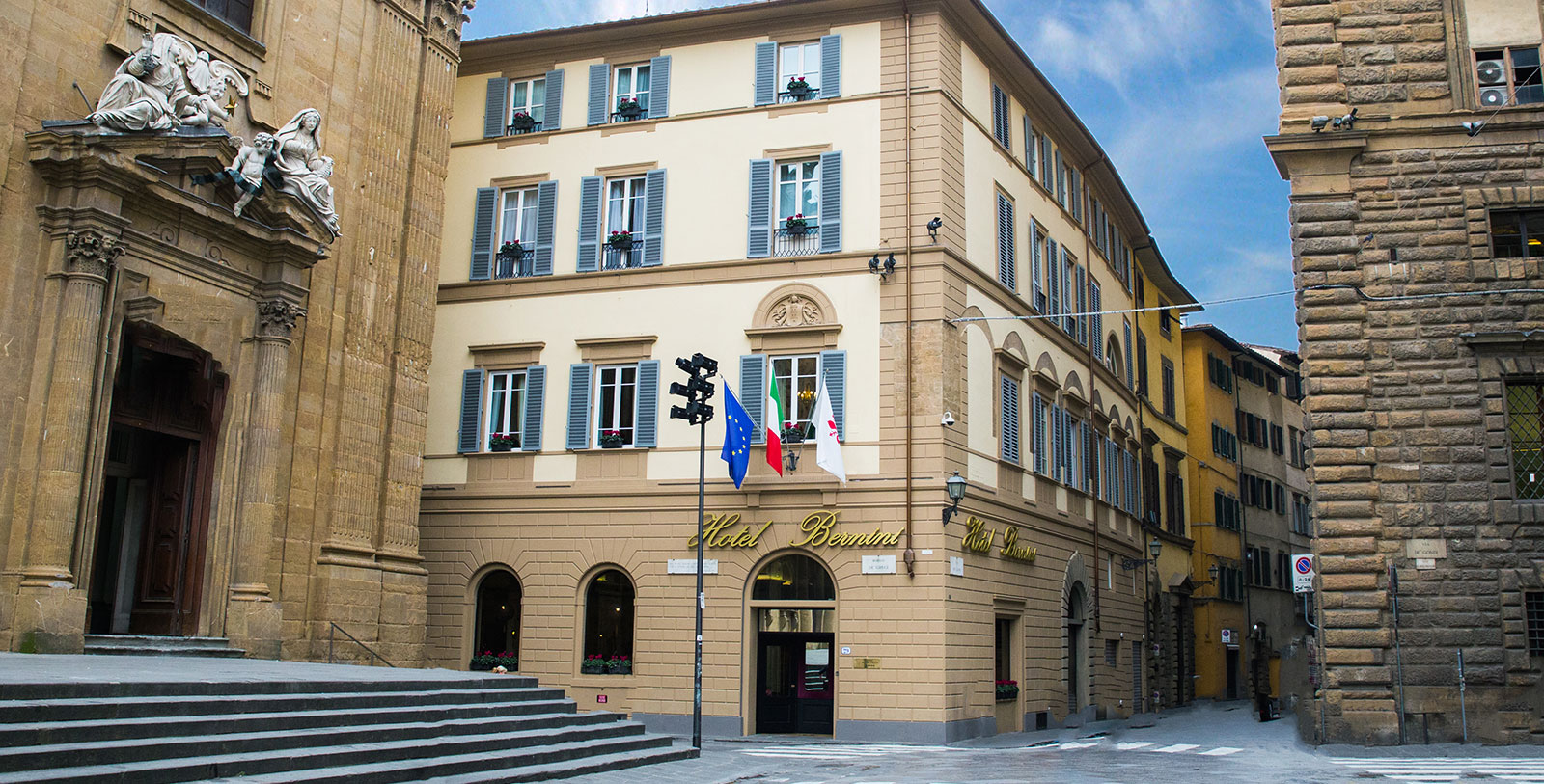 a building with flags on the front
