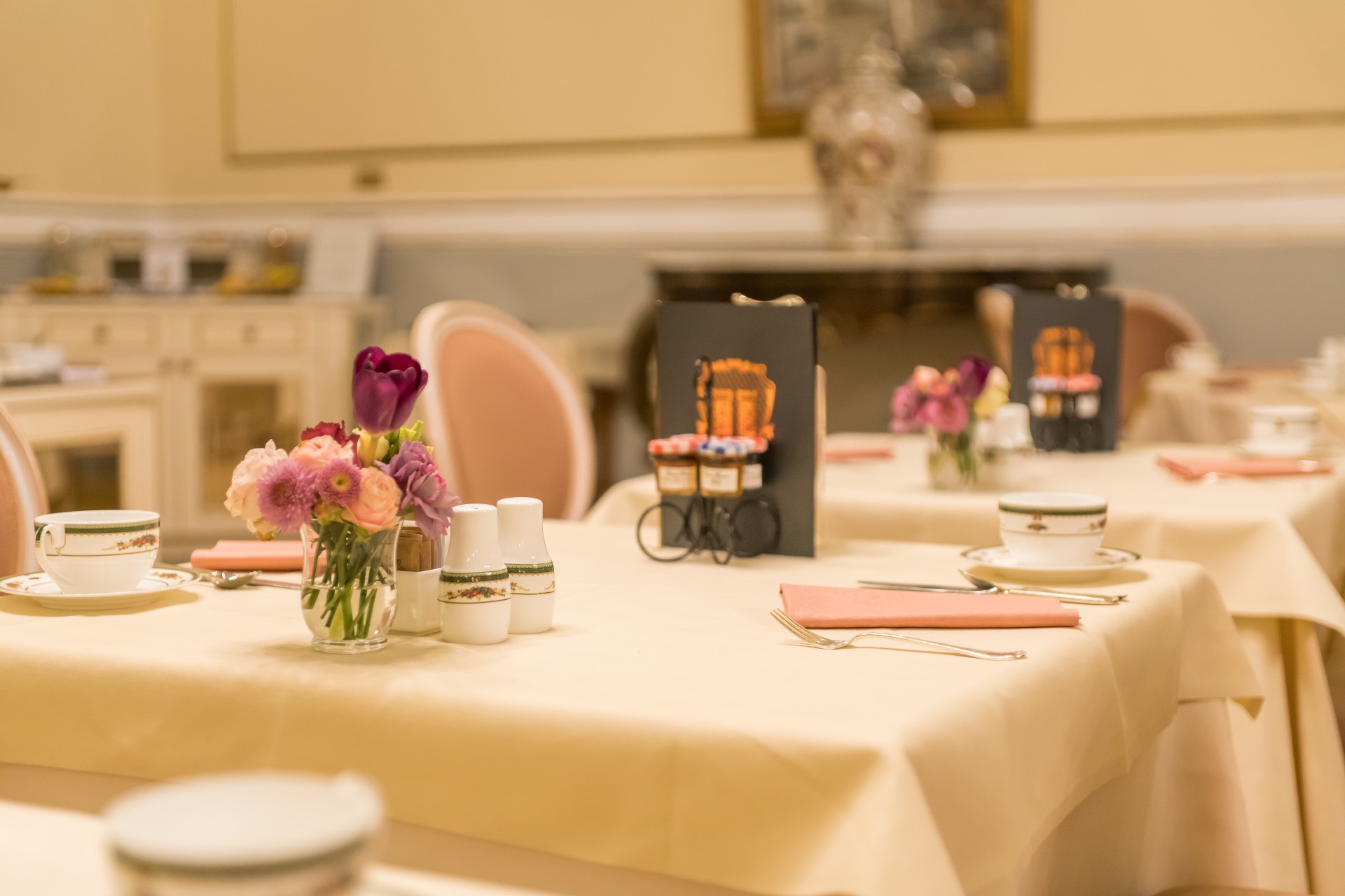 a table set for two with flowers on it