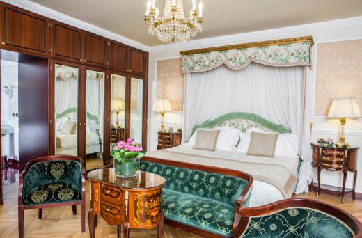 a bedroom with a bed and a table