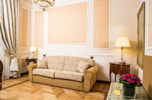 a living room with a couch and lamp