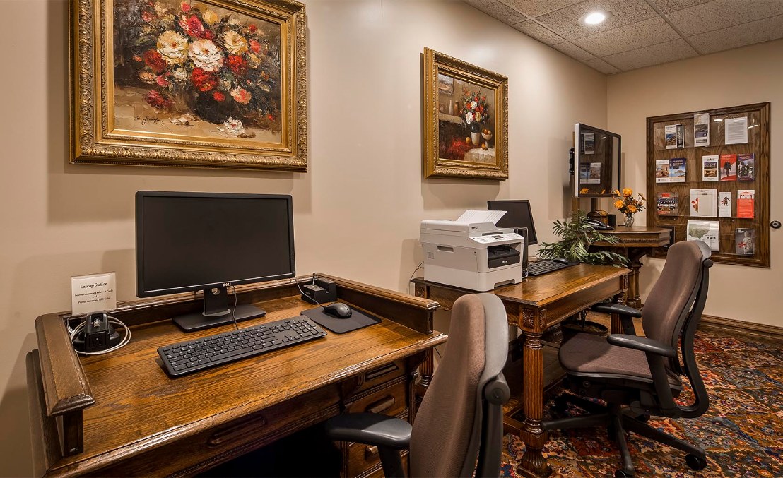 a room with computers and a printer