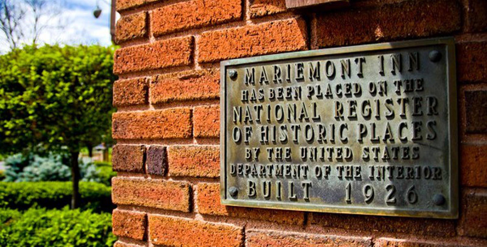 a sign on a brick wall