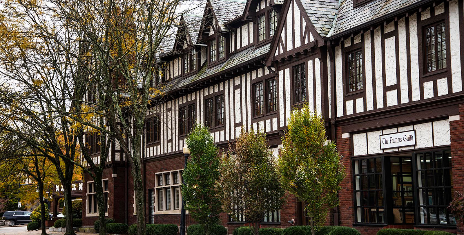 a building with trees and bushes