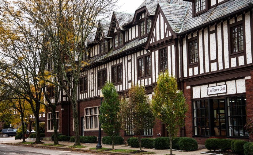 a building with trees and street lights