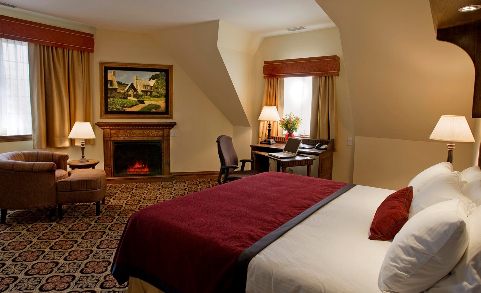 a bedroom with a bed and a fireplace