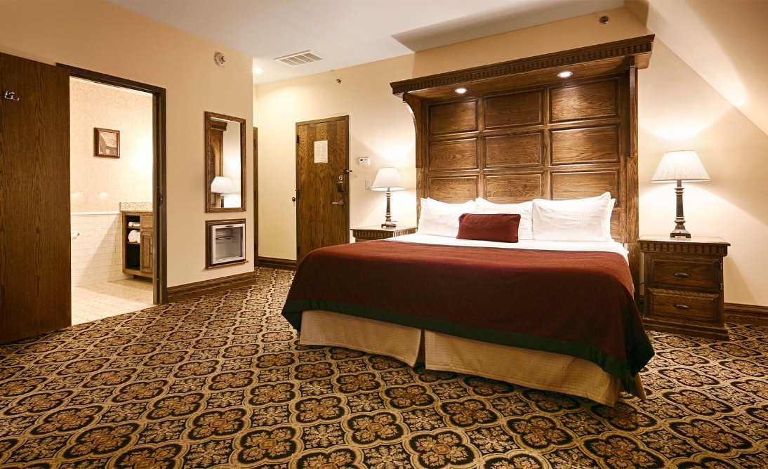 a room with a bed and a mirror