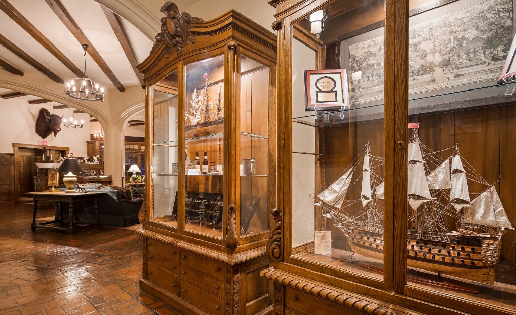 a wooden cabinet with a glass case