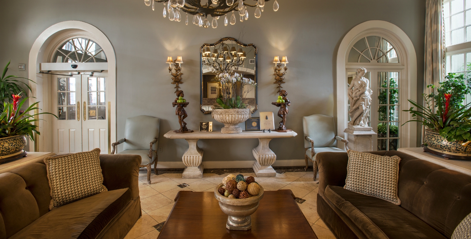 a room with a table and chandelier
