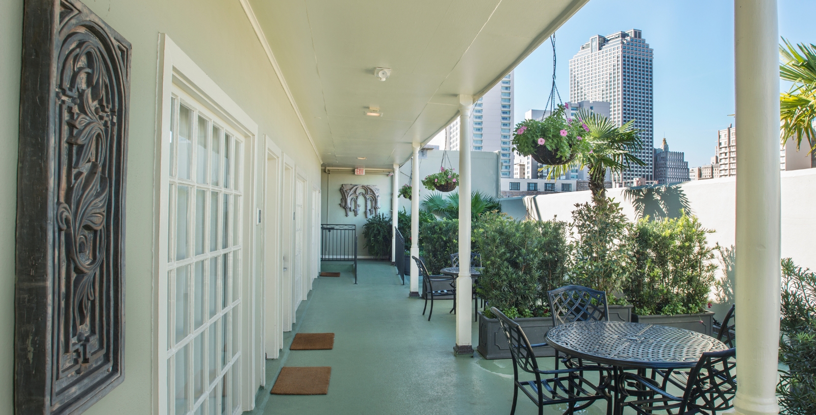 a patio with chairs and tables