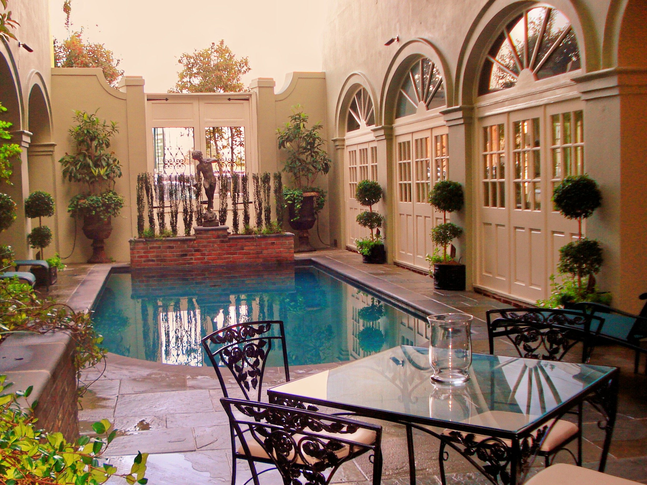 a pool with a table and chairs