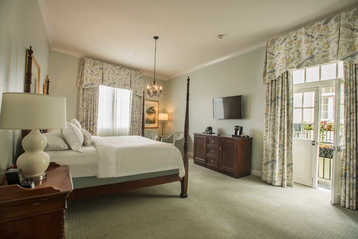 a bedroom with a bed and a television