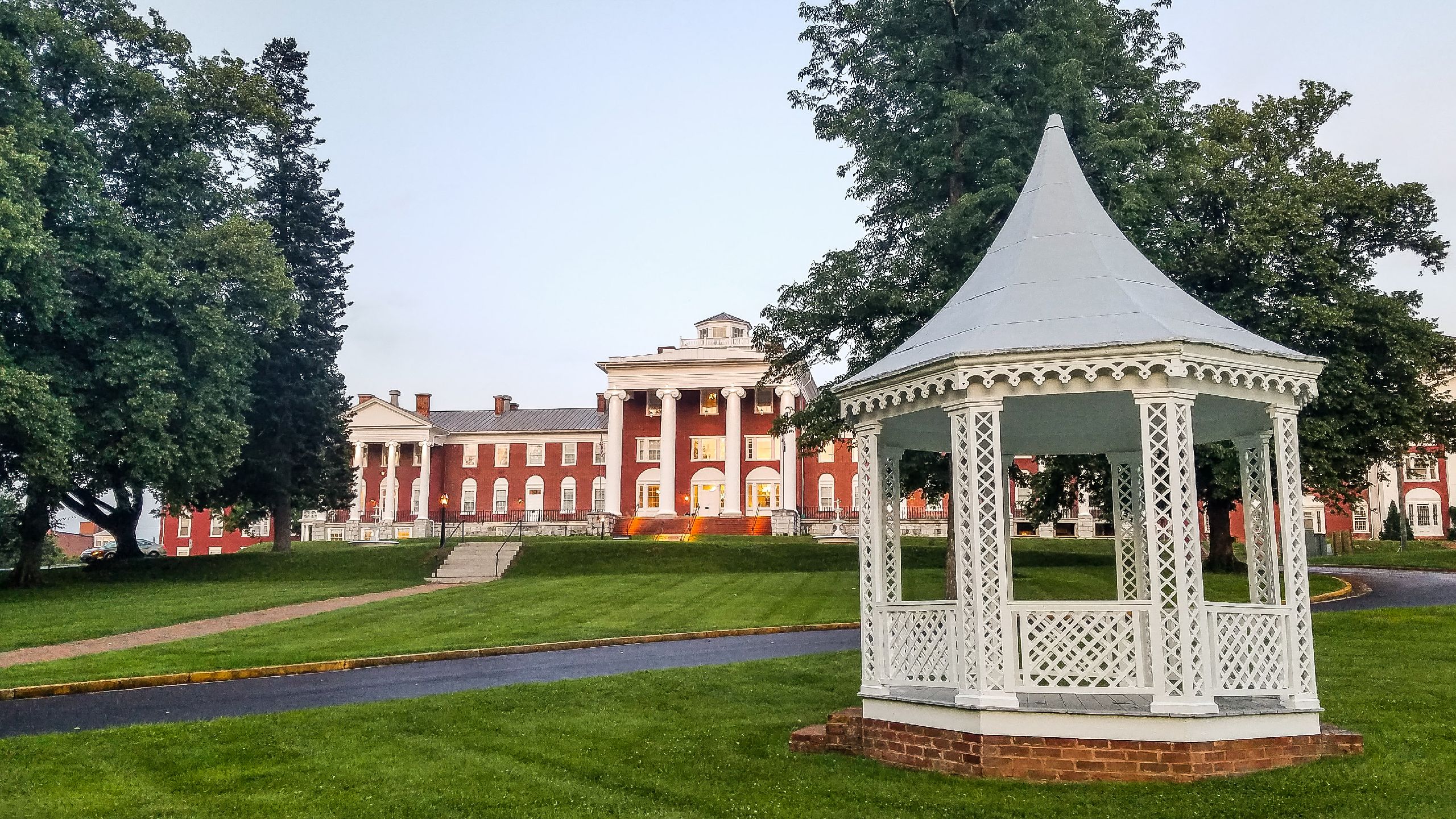 a white gazebo in front of a building