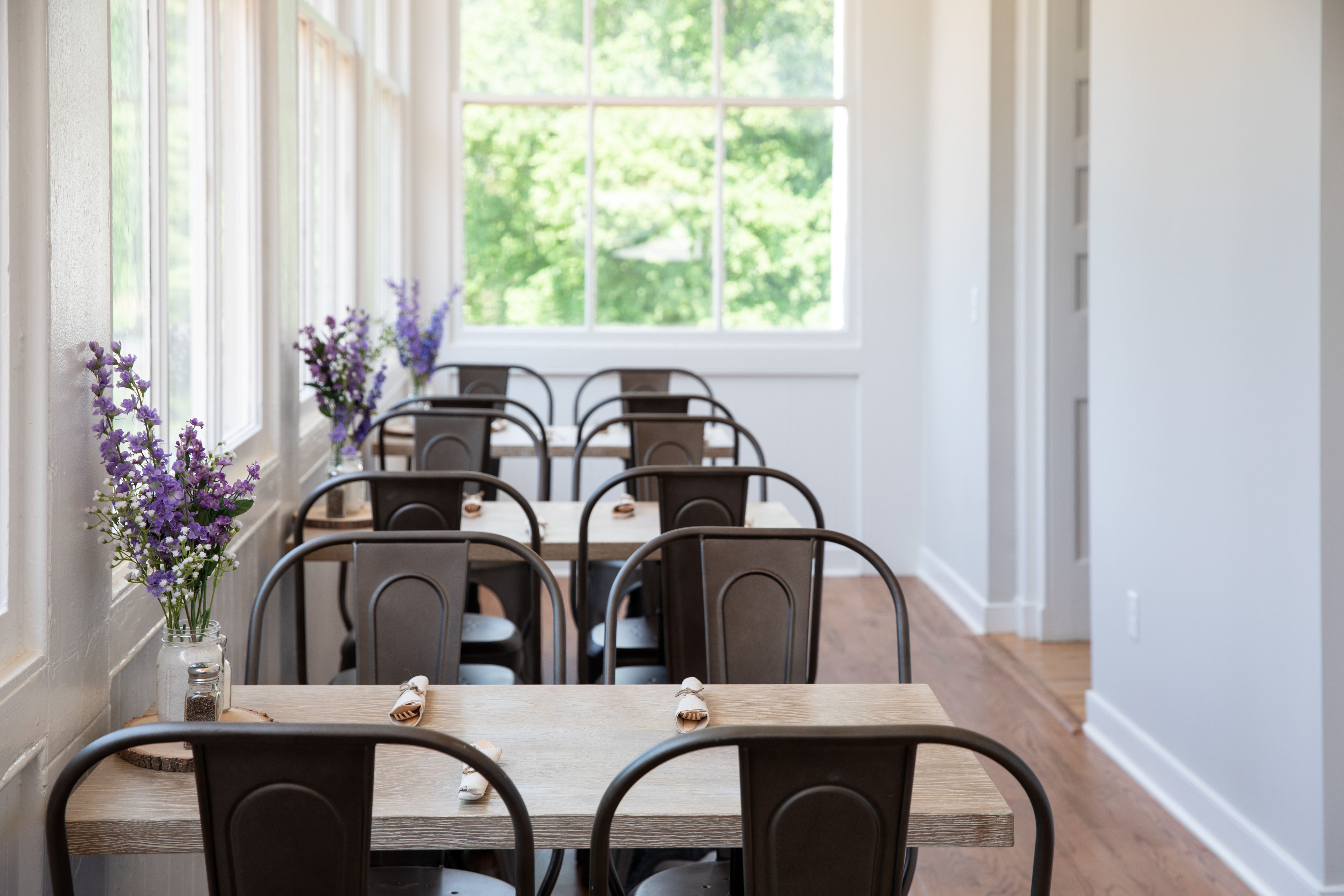 a room with tables and chairs