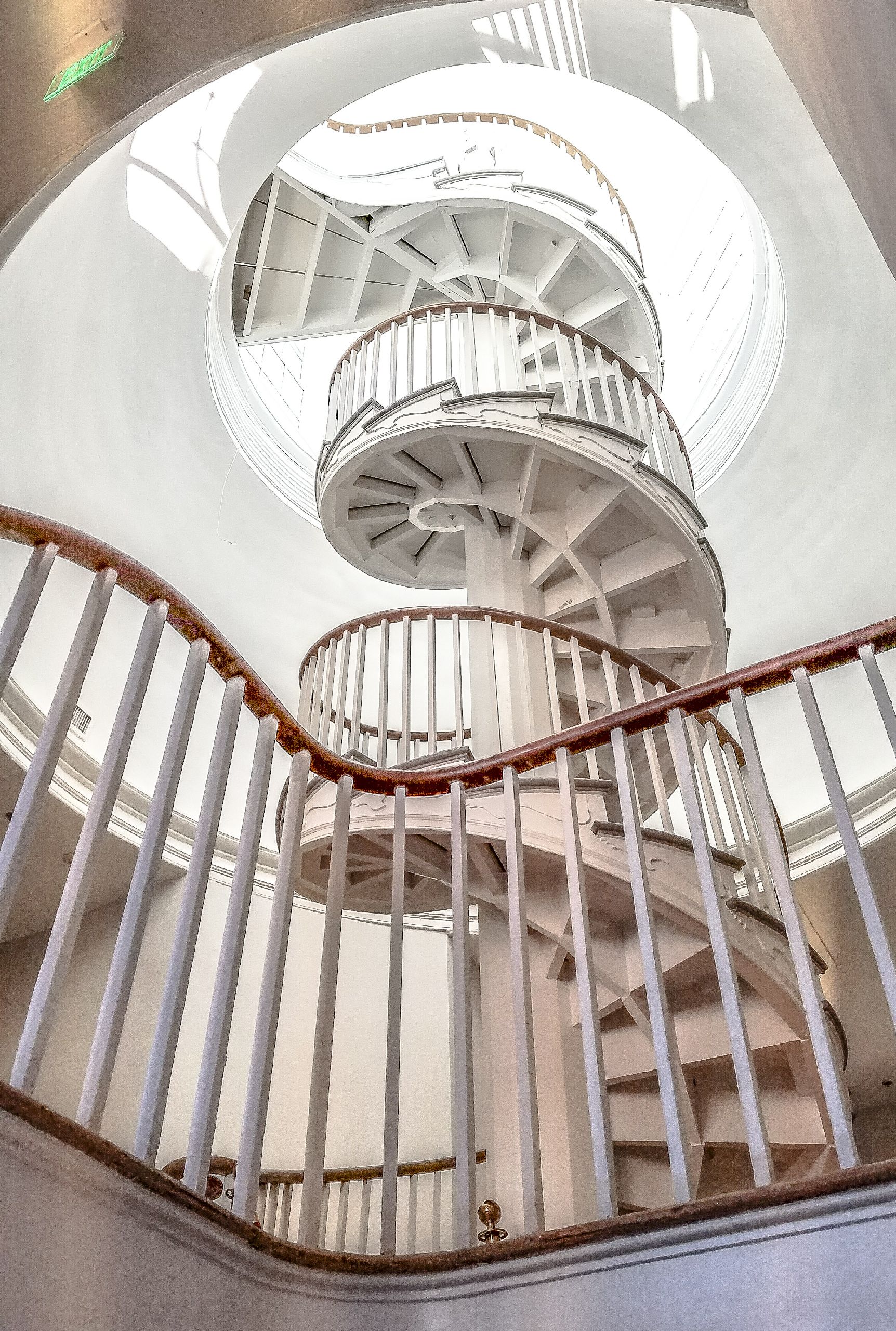 a spiral staircase with a circular ceiling