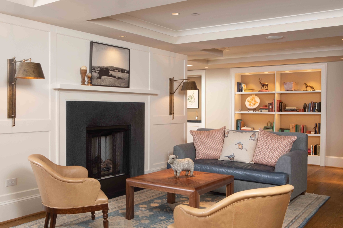 a living room with a fireplace and a couch