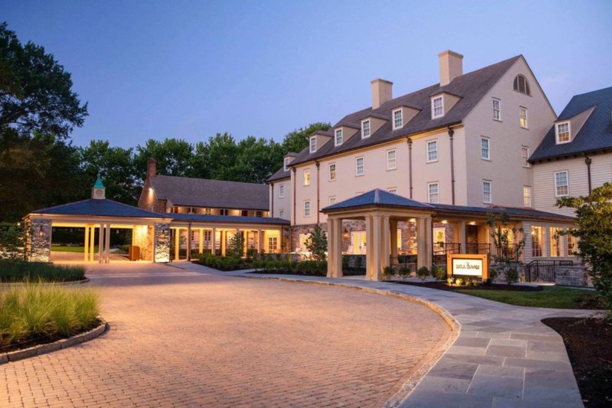 a large building with a driveway and a driveway