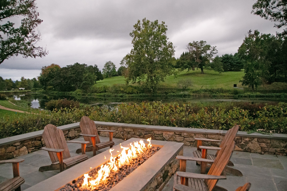 a fire pit with chairs around it
