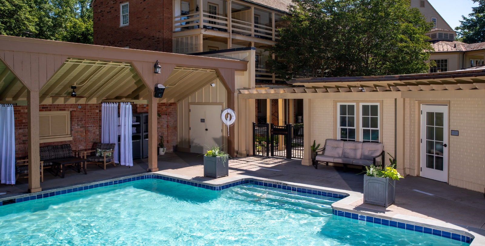 a swimming pool with a deck and a building