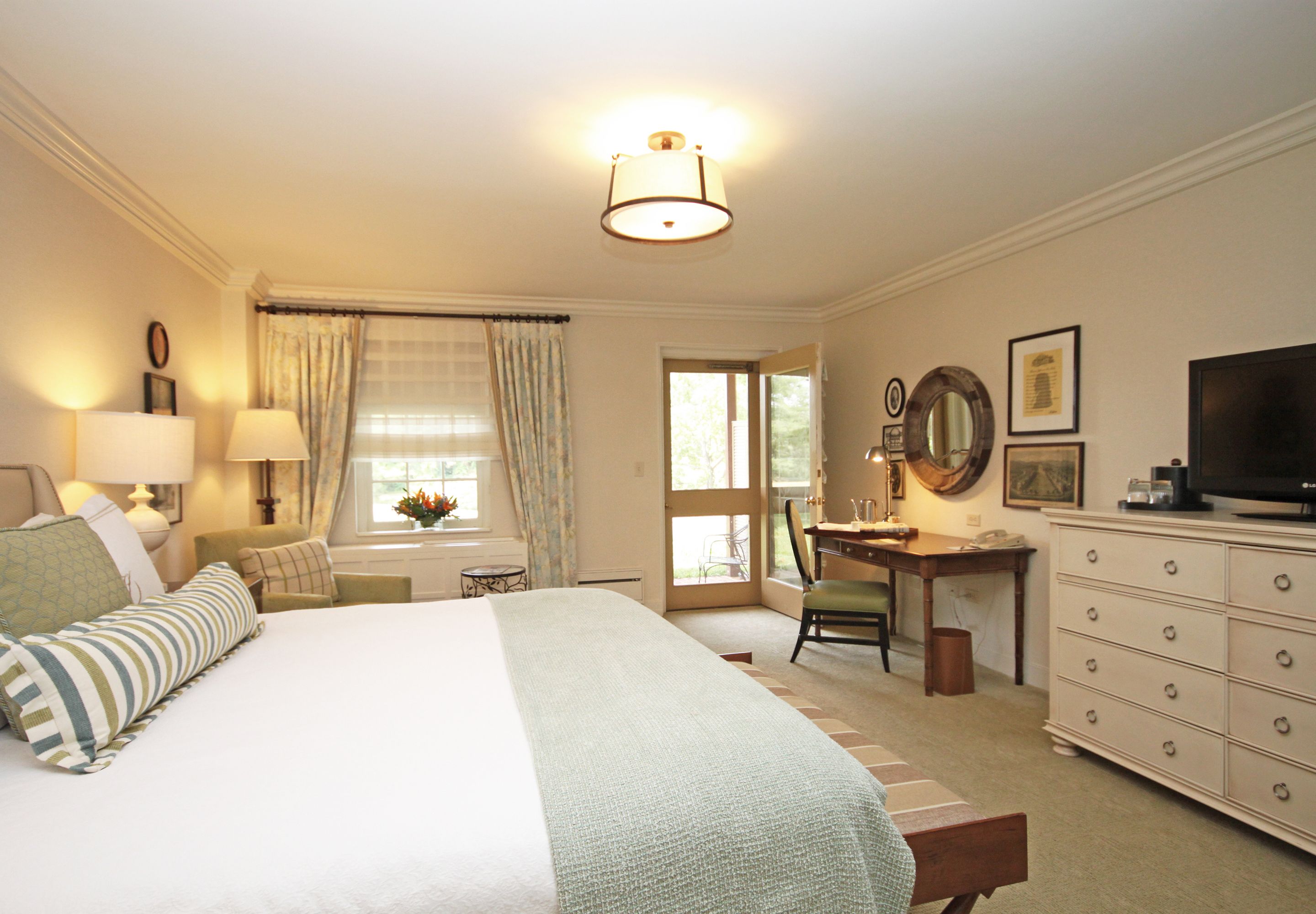 a bedroom with a bed and desk