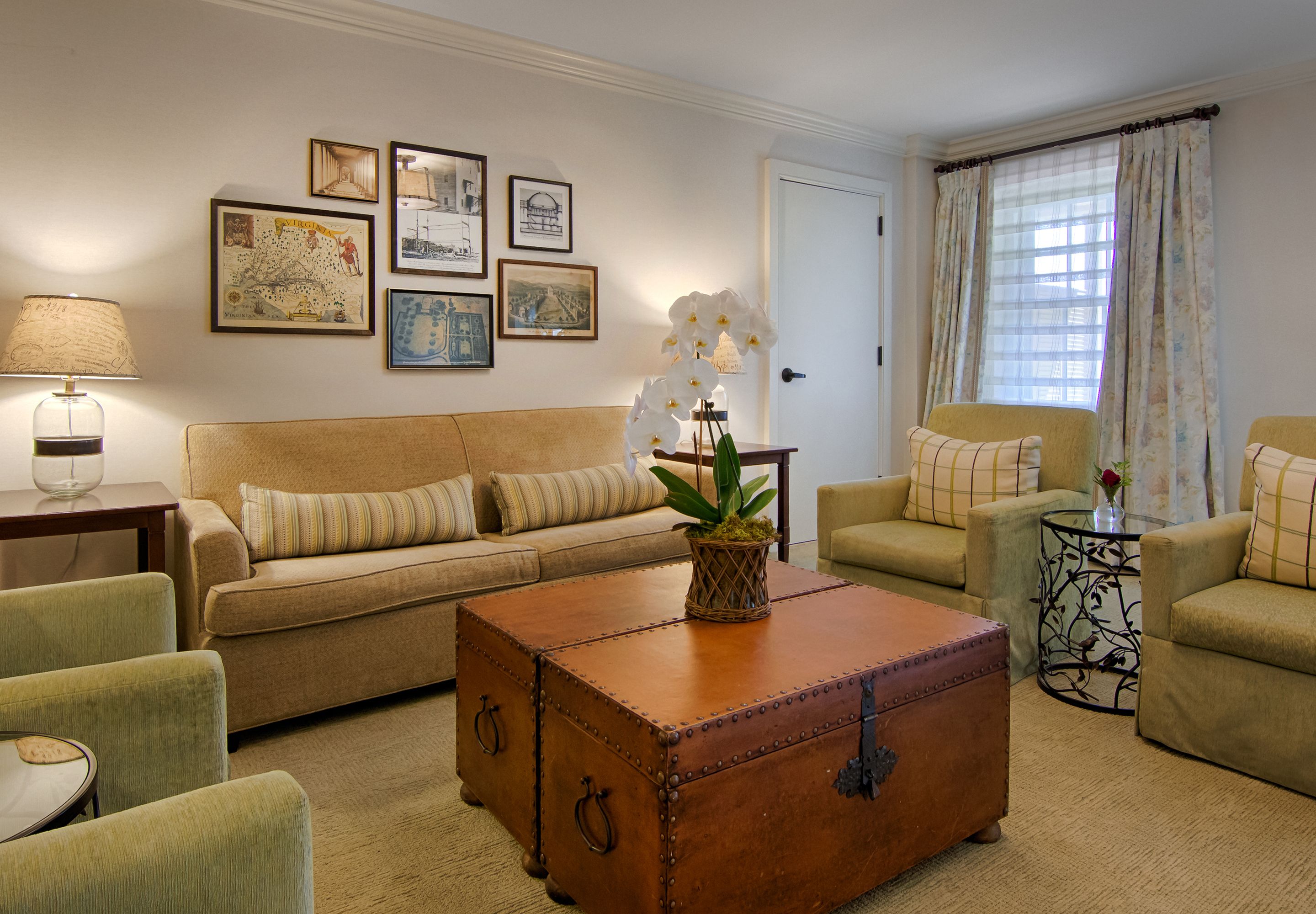 a living room with a coffee table and couches